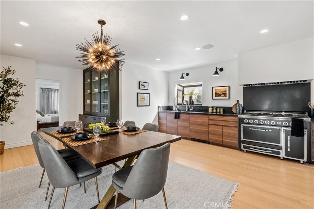 19 Wideloop Road Rolling Hills, CA 90274 - Photo 3 of 35 a kitchen with stainless steel appliances a dining table and chairs