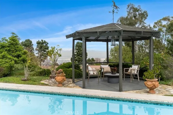 an outdoor view of the patio and swimming pool