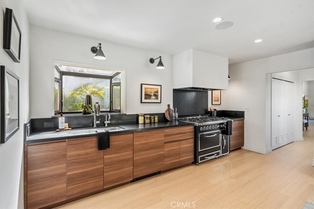 19 Wideloop Road Rolling Hills, CA 90274 - Photo 10 of 35 a kitchen with stainless steel appliances granite countertop a sink and a stove