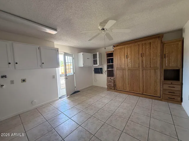 a view of a livingroom with furniture and an entryway