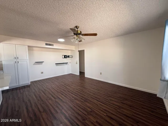 a metallic refrigerator freezer sitting in a kitchen