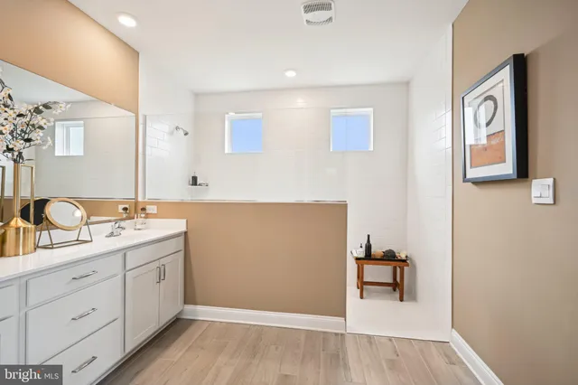 a bathroom with a bathtub and a shower
