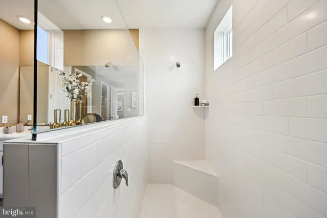 a view of a patio with dining table and chairs with wooden floor and fence