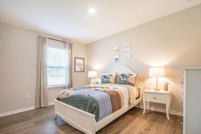 1407 Needle Palm Drive Edgewater, FL 32132 - Photo 15 of 28 a bedroom with a bed and a window