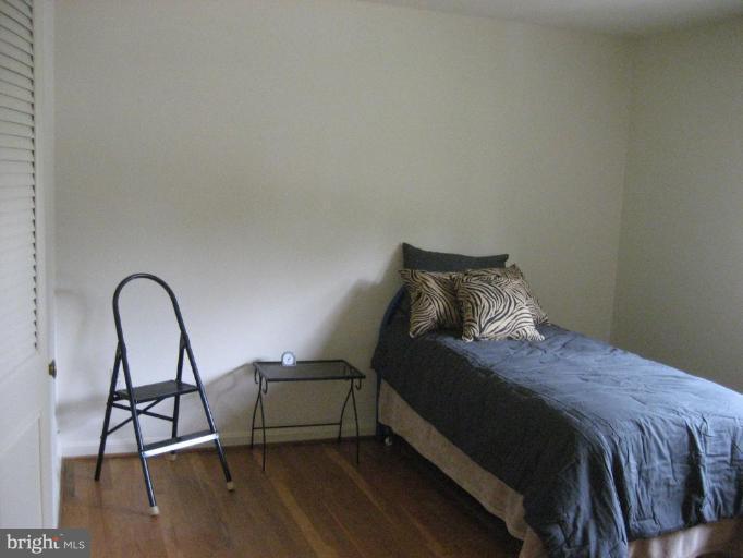 5503 Callander Drive Springfield, VA 22151 - Photo 12 of 28 a bedroom with a bed a desk and chair