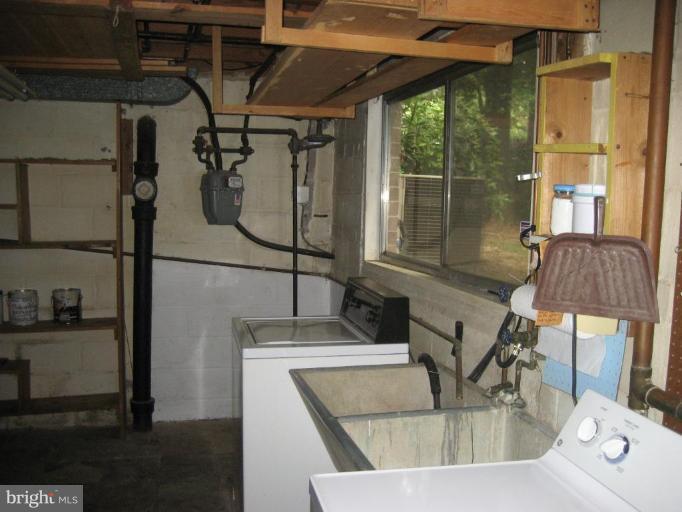 5503 Callander Drive Springfield, VA 22151 - Photo 22 of 28 a view of a kitchen with a sink and couch