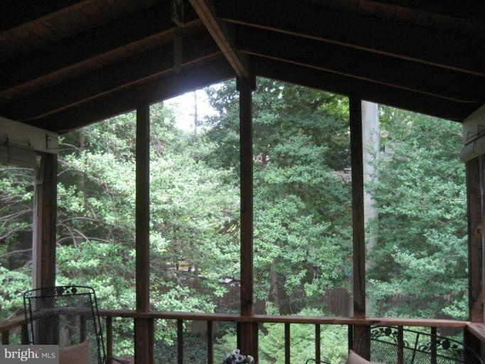 5503 Callander Drive Springfield, VA 22151 - Photo 7 of 28 a view of a room with large windows and wooden floor