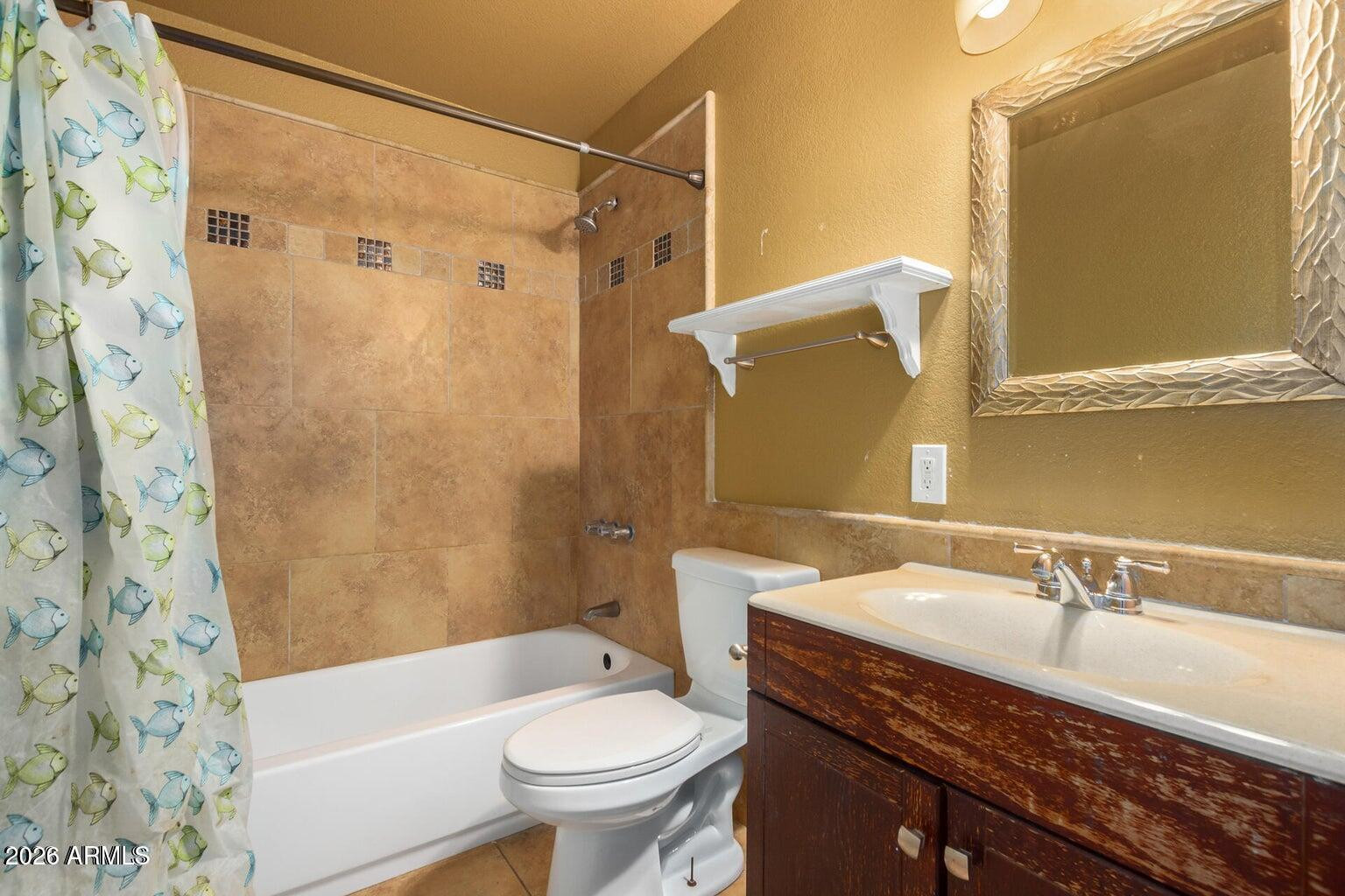 7340 North 7th Avenue Phoenix, AZ 85021 - Photo 16 of 37 a bathroom with a sink and a mirror