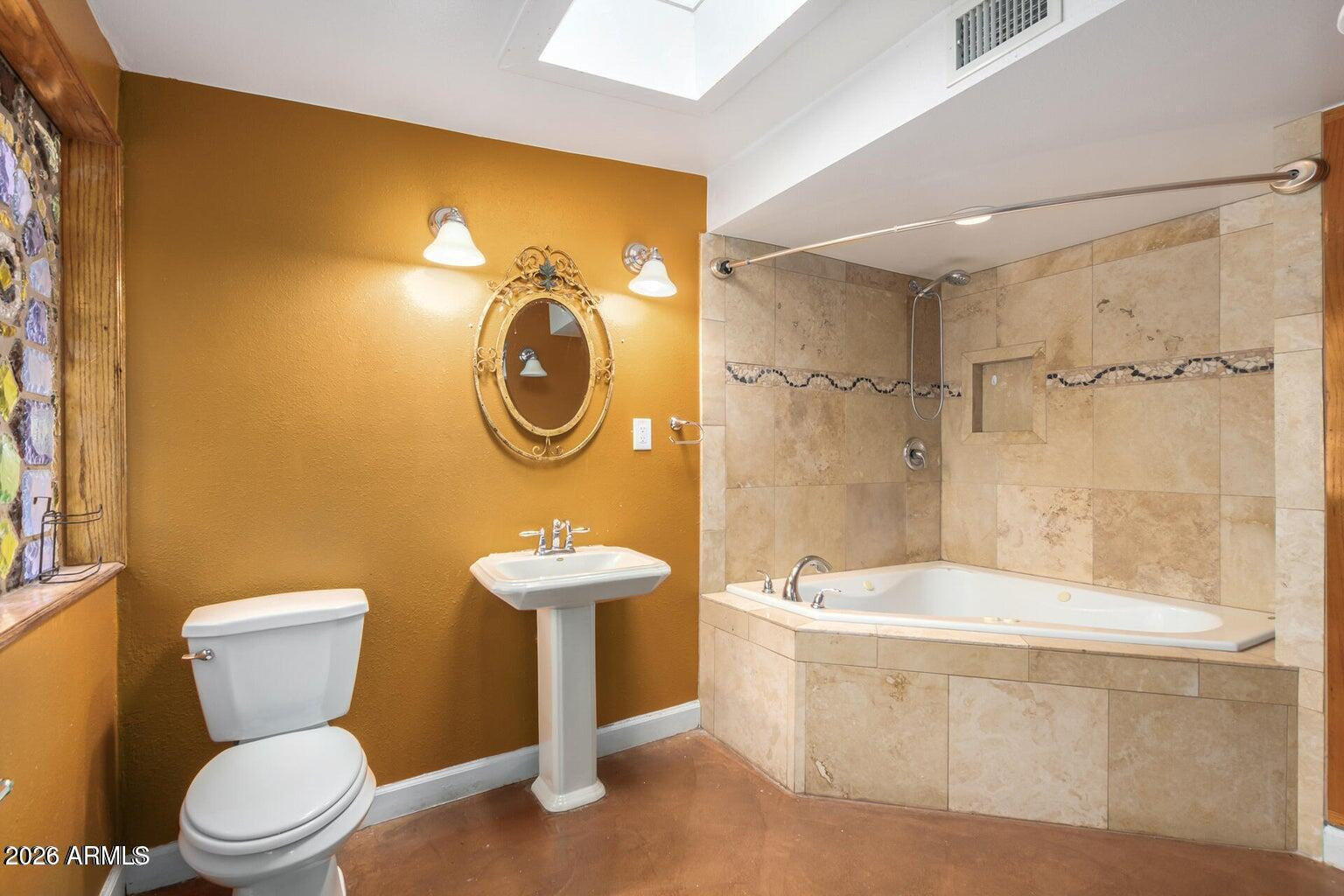 7340 North 7th Avenue Phoenix, AZ 85021 - Photo 24 of 37 a bathroom with a toilet a sink and bathtub