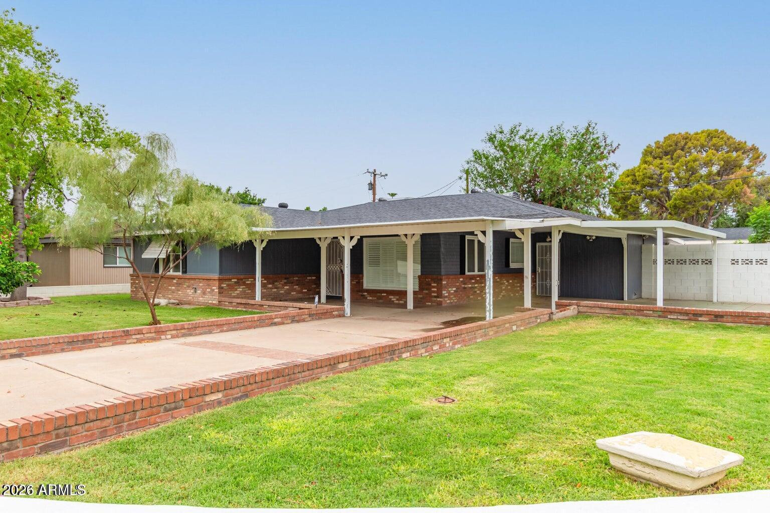 7340 North 7th Avenue Phoenix, AZ 85021 - Photo 35 of 37 front view of a house with a yard