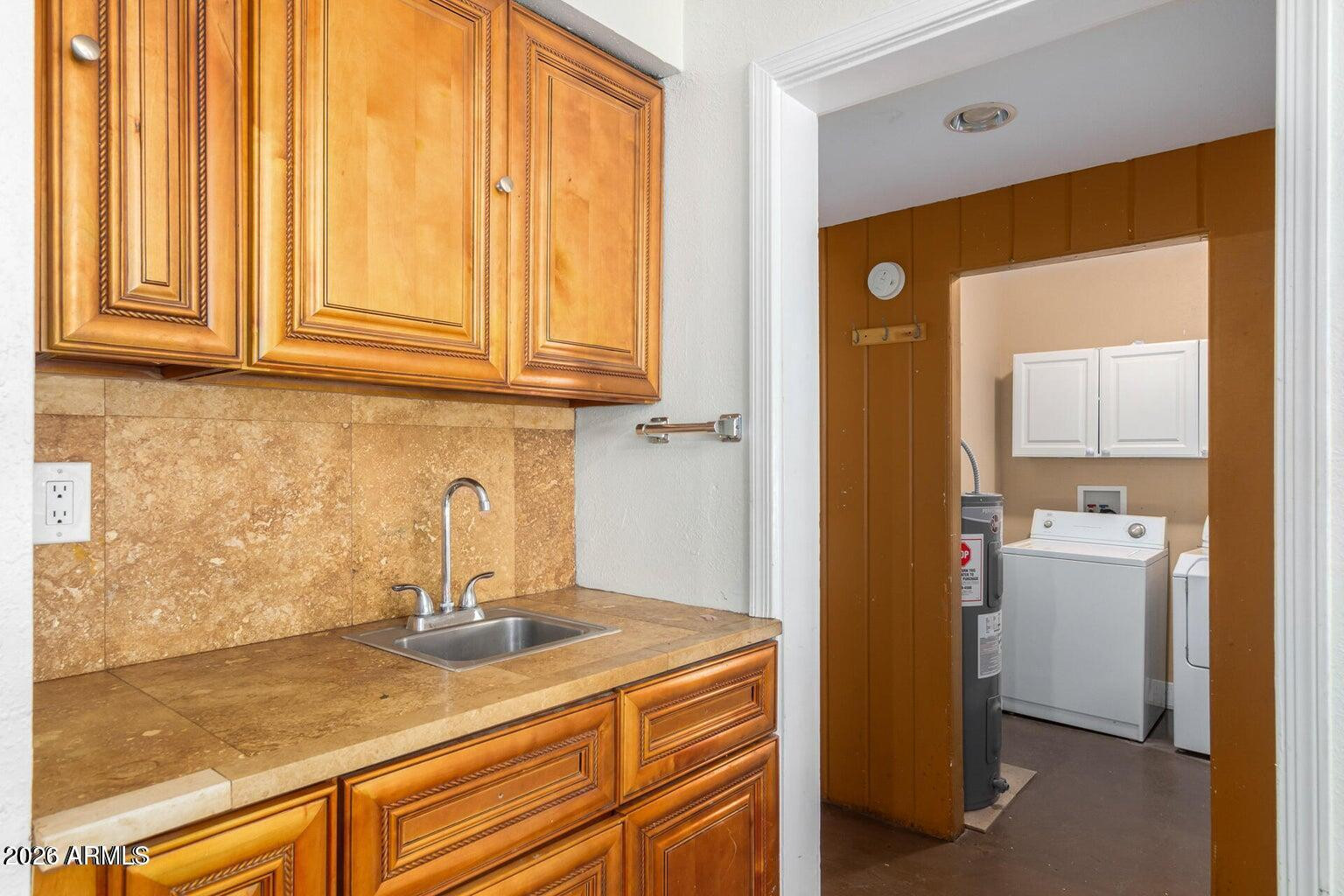 7340 North 7th Avenue Phoenix, AZ 85021 - Photo 6 of 37 a kitchen with a sink and cabinets