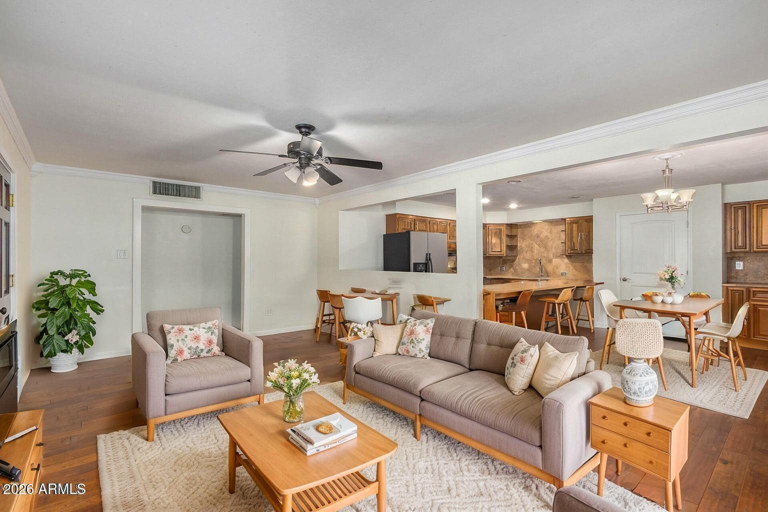 7340 North 7th Avenue Phoenix, AZ 85021 - Photo 7 of 37 a living room with furniture and a chandelier