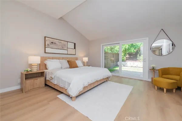 a bedroom with a bed and a chair