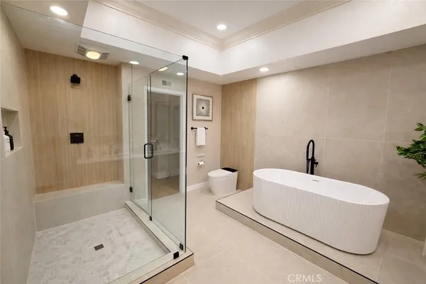 a bathroom with a bathtub and a shower