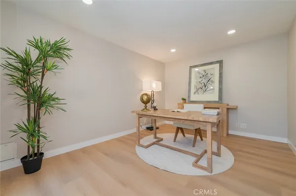 a workspace with furniture and a potted plant