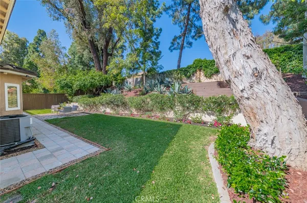 a view of a backyard with sitting area