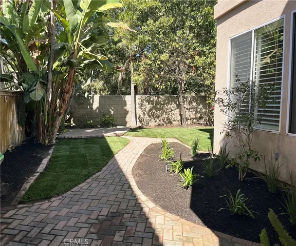 a view of yard with patio