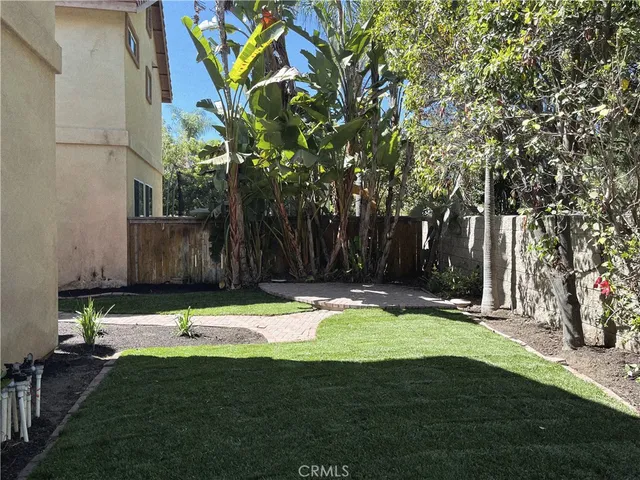 a backyard of a house with lots of green space