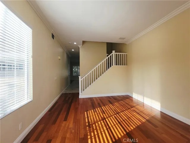 a view of entryway with wooden floor