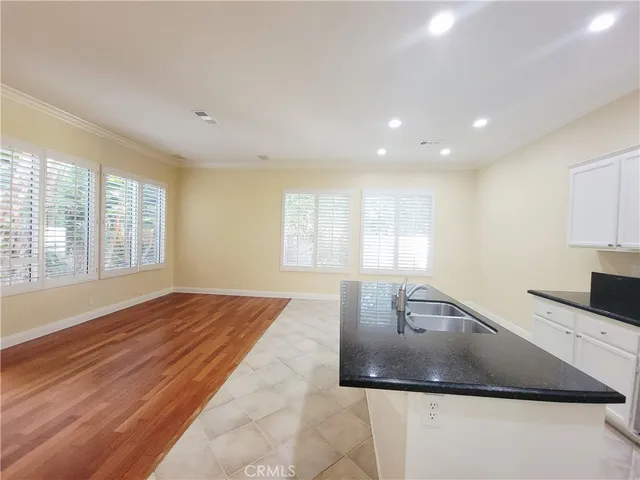 a view of a kitchen with a sink and a window