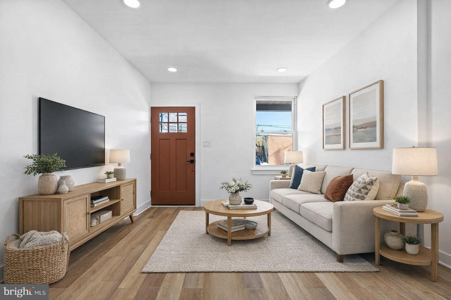 1502 South 52nd Street, Unit A Philadelphia, PA 19143 - Photo 1 of 13 a living room with furniture and a flat screen tv