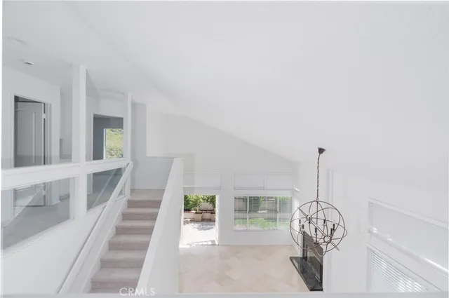 a view of an entryway with wooden floor