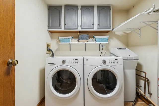 a close view of a utility room with dryer and washer