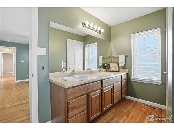 a bathroom with a sink a vanity and a mirror