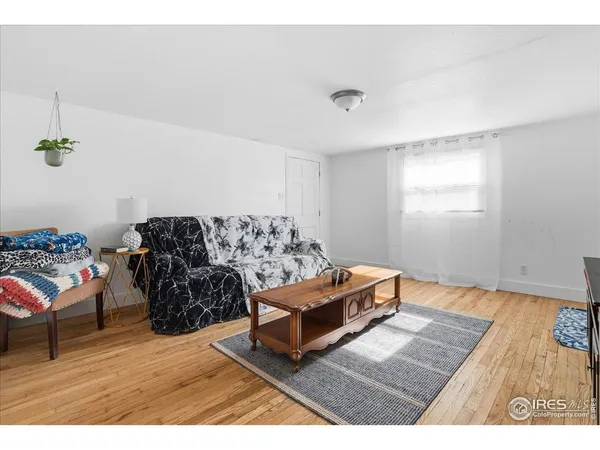 a bedroom with a bed and a mirror
