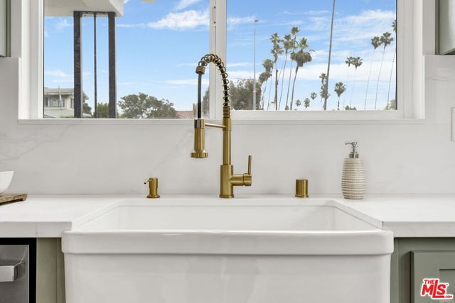 a bathroom with a sink and a window