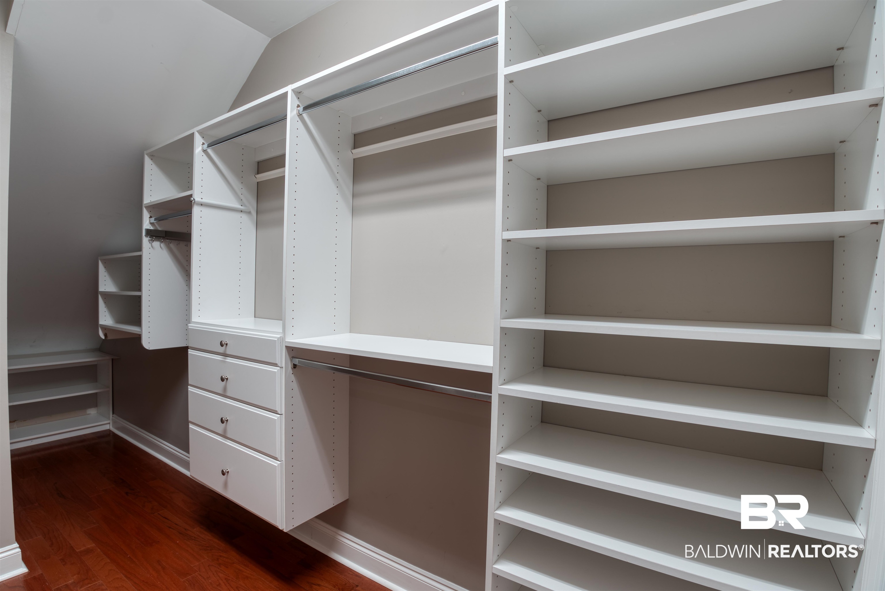 24561 Austin Road Daphne, AL 36526 - Photo 25 of 57 Spacious closet with dark wood-type flooring and vaulted ceiling