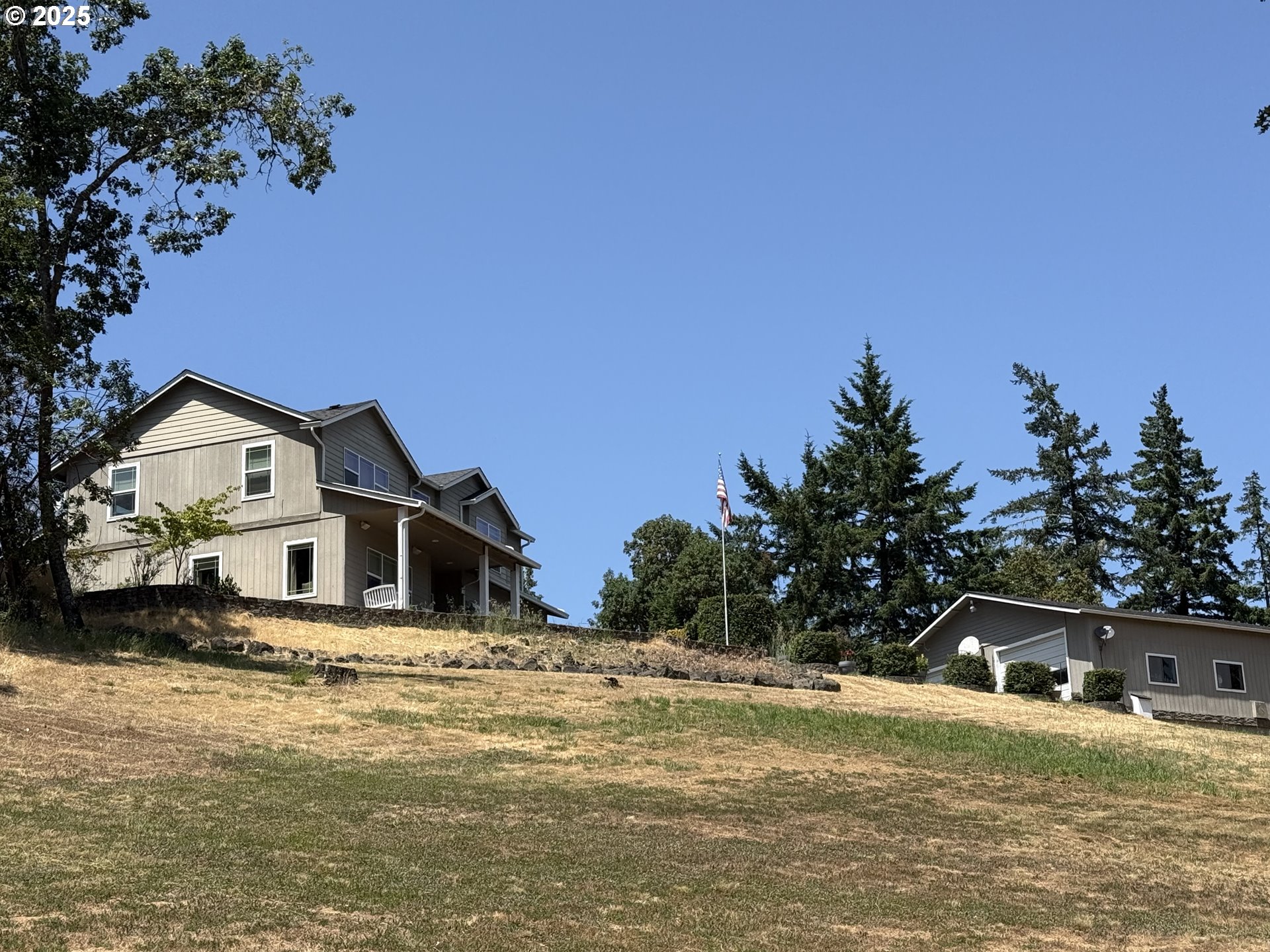 4447 Melrose Road Roseburg, OR 97471 - Photo 14 of 44 a front view of a house with a yard and trees
