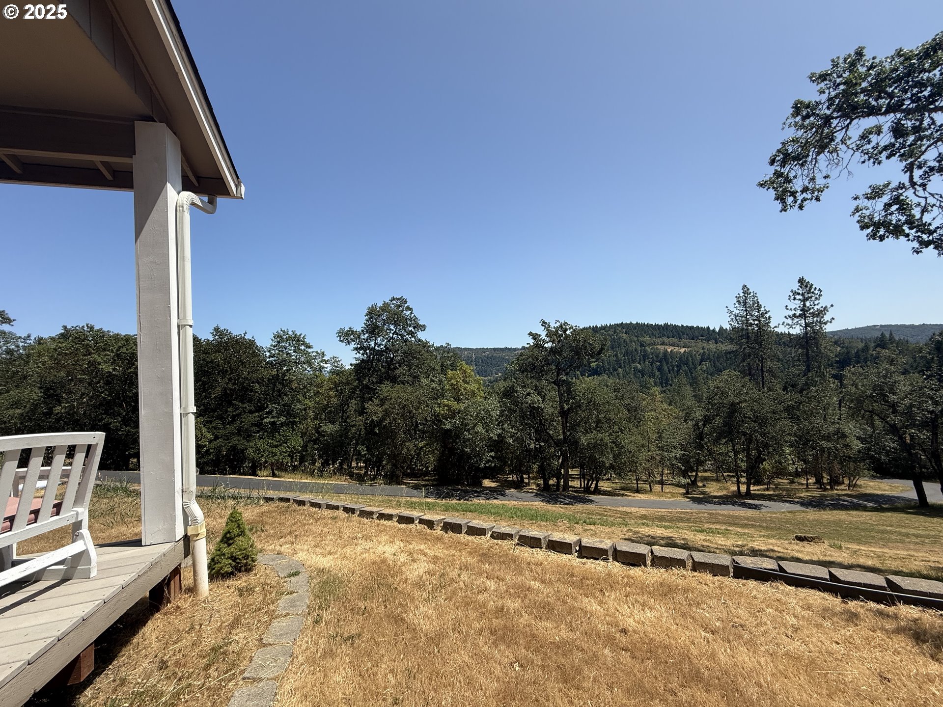 4447 Melrose Road Roseburg, OR 97471 - Photo 25 of 44 a view of a house with a outdoor space