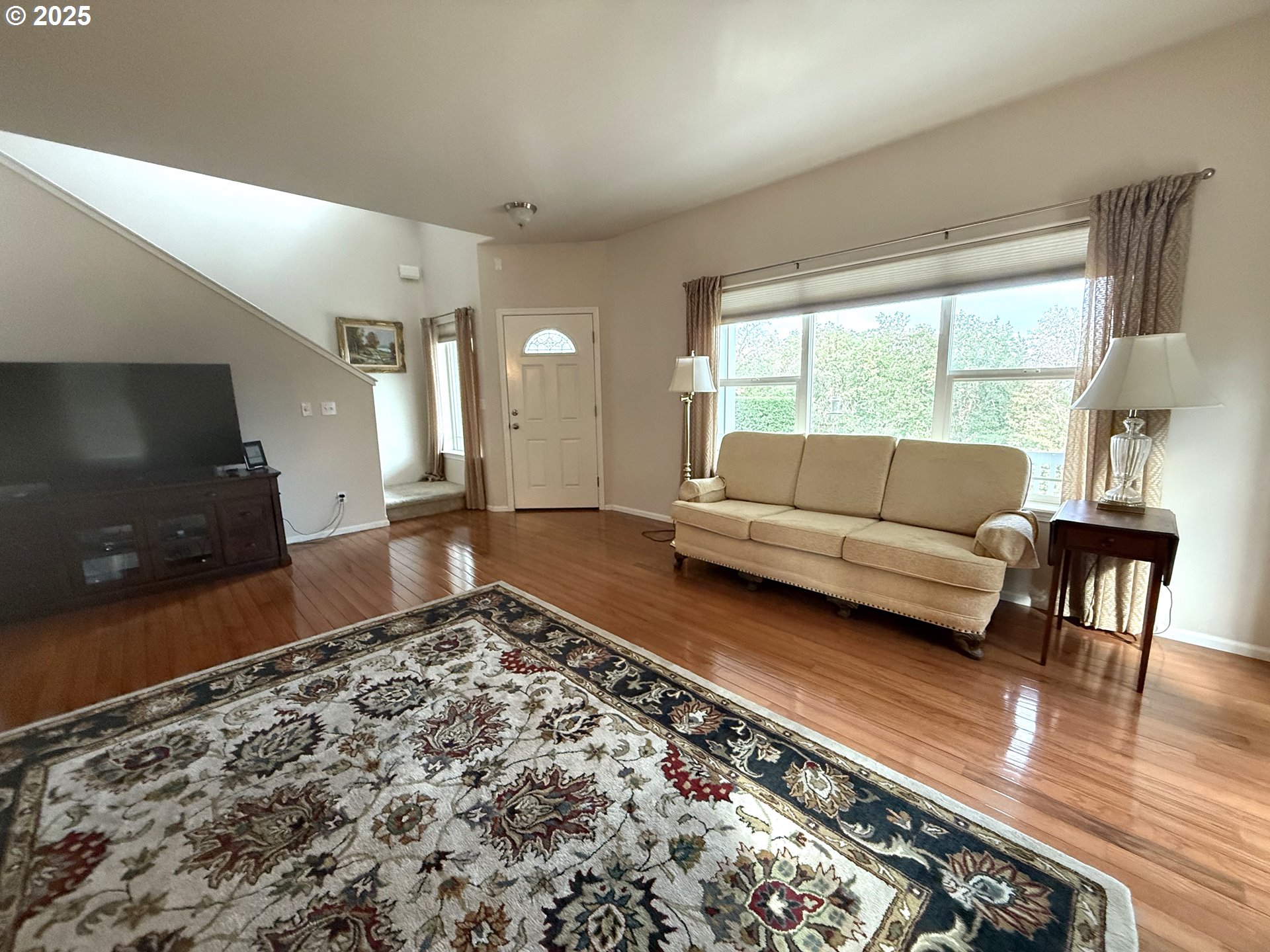 4447 Melrose Road Roseburg, OR 97471 - Photo 7 of 44 a living room with a couch and a flat screen tv