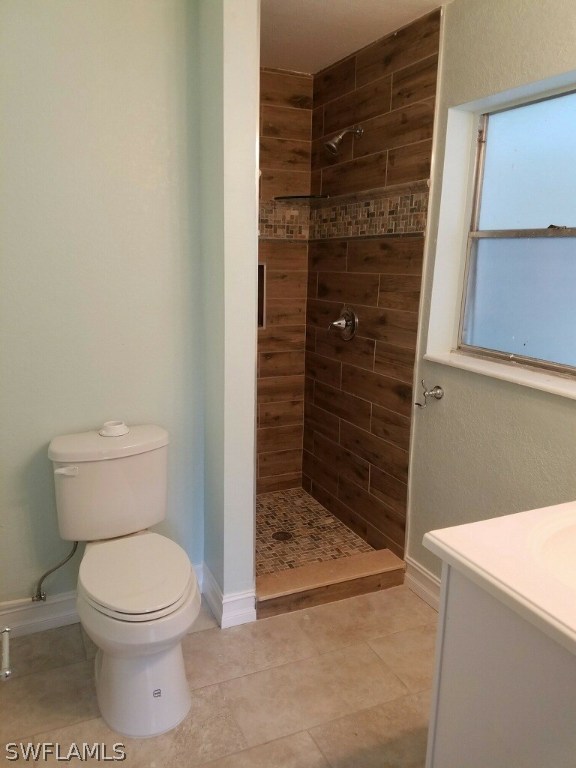 2201 Caladium Road Fort Myers, FL 33905 - Photo 8 of 14 a bathroom with a toilet and a shower