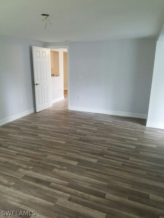 2201 Caladium Road Fort Myers, FL 33905 - Photo 9 of 14 a view of an empty room with wooden floor and a window