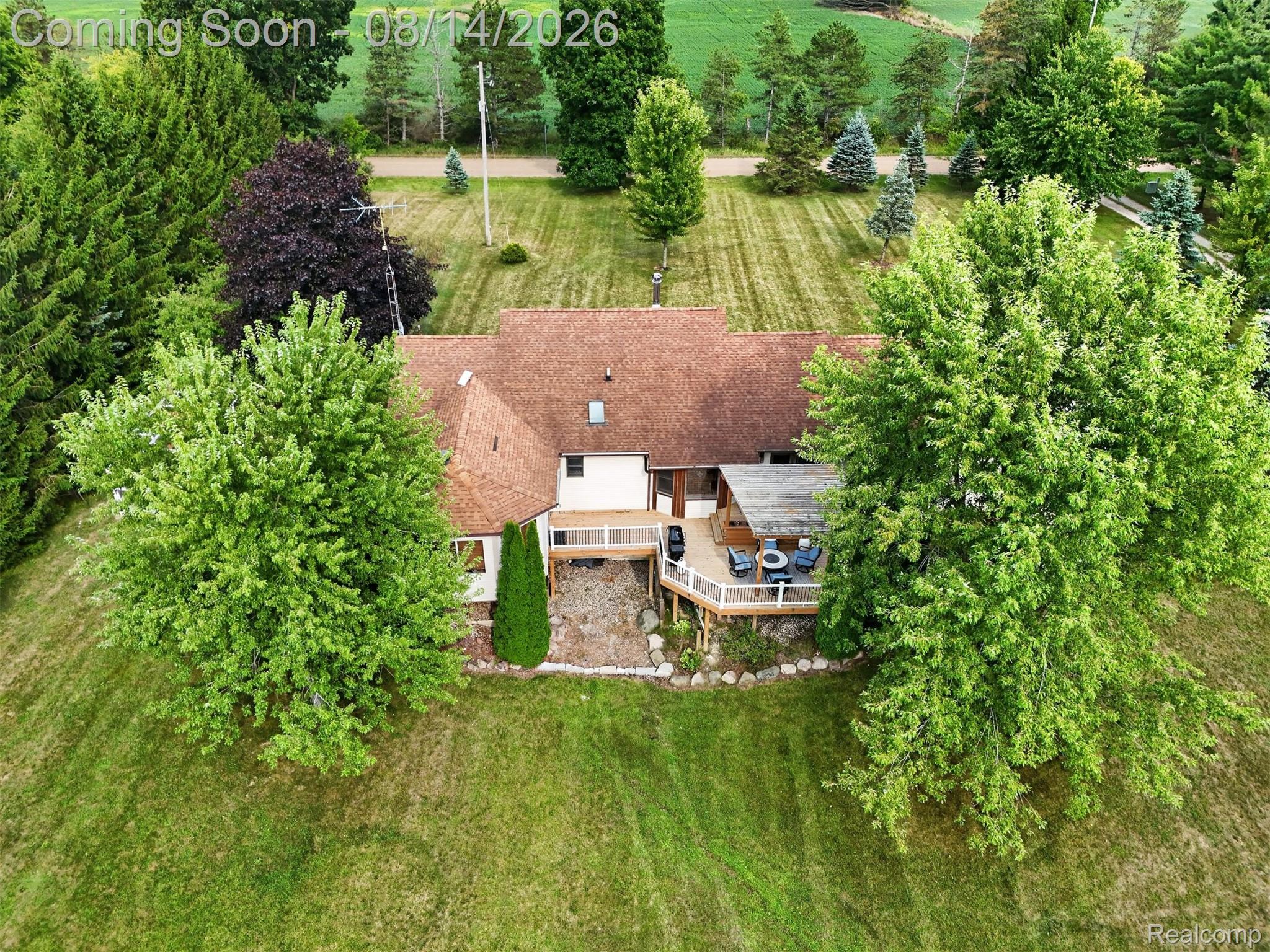11342 South Morrish Road Gaines, MI 48436 - Photo 21 of 26 Expansive yard with mature trees, a multi-level wood deck, and an attached covered patio