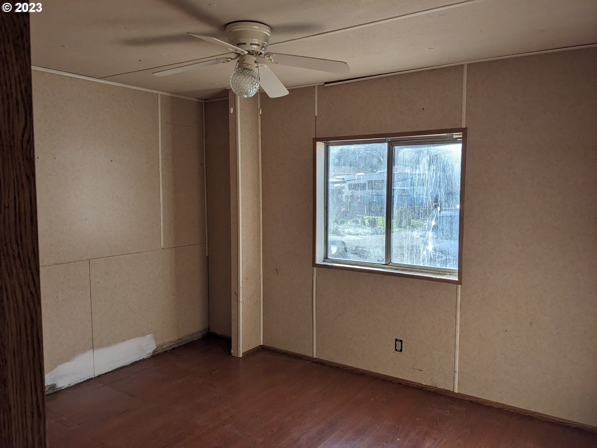 32905 James Street, Unit 20 Scappoose, OR 97056 - Photo 5 of 8 an empty room with windows and fan