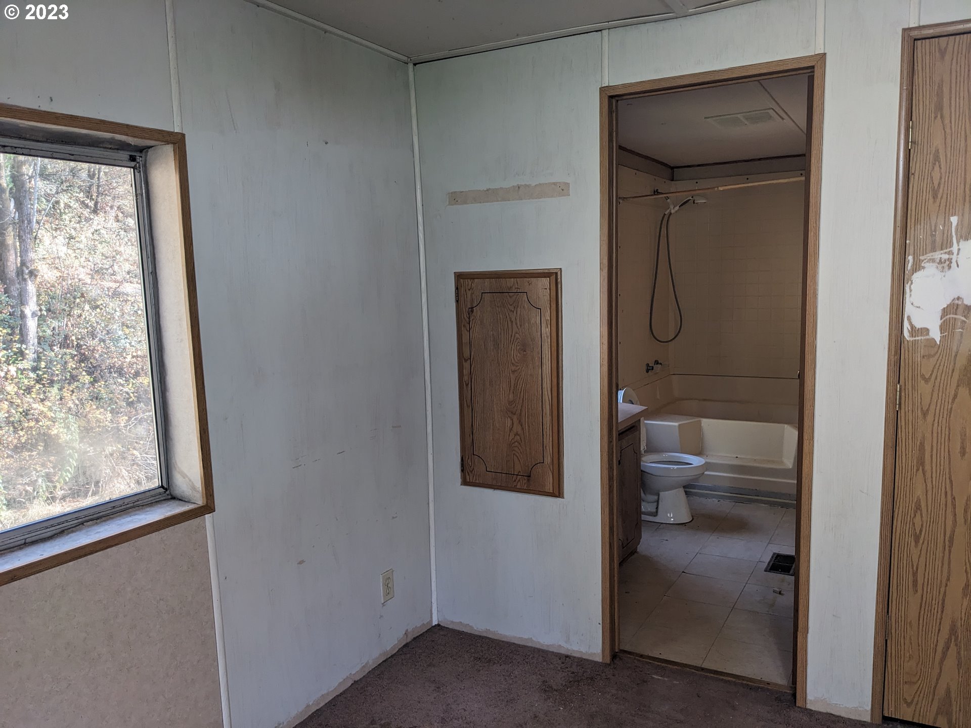 32905 James Street, Unit 20 Scappoose, OR 97056 - Photo 8 of 8 a bathroom with a glass shower door