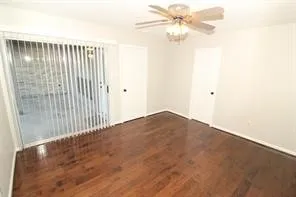 a view of a room with a ceiling fan