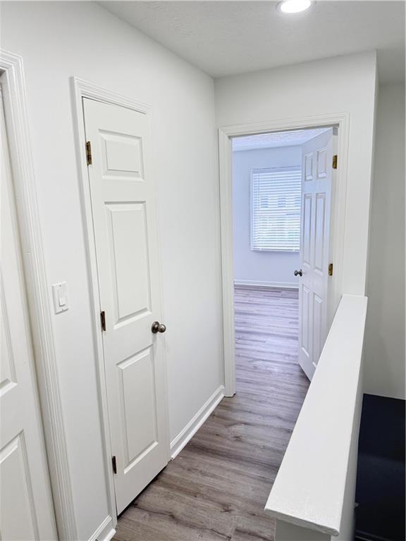 2356 Cove Road Lithonia, GA 30058 - Photo 11 of 20 a view of a hallway with wooden floor