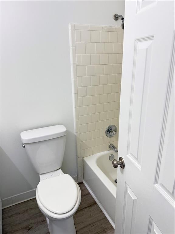 2356 Cove Road Lithonia, GA 30058 - Photo 13 of 20 a white toilet sitting next to a bathroom sink