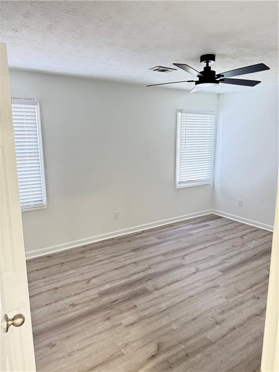 2356 Cove Road Lithonia, GA 30058 - Photo 14 of 20 wooden floor in an empty room with a window
