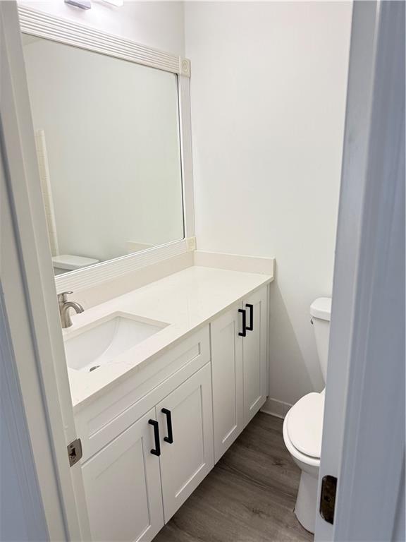 2356 Cove Road Lithonia, GA 30058 - Photo 15 of 20 a bathroom with a sink a toilet and a mirror