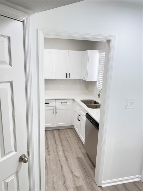 2356 Cove Road Lithonia, GA 30058 - Photo 2 of 20 a kitchen with white cabinets and white appliances