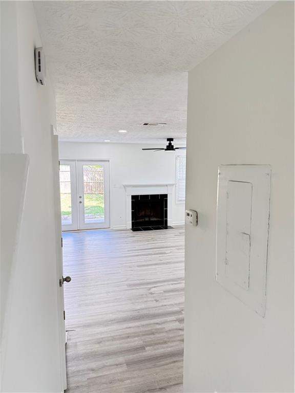 2356 Cove Road Lithonia, GA 30058 - Photo 3 of 20 a living room with a fireplace and a flat screen tv