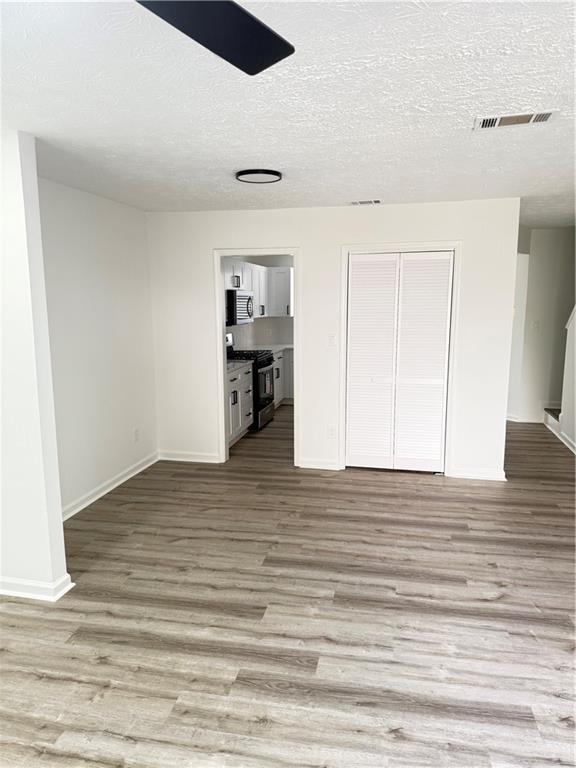 2356 Cove Road Lithonia, GA 30058 - Photo 7 of 20 a view of empty room with wooden floor