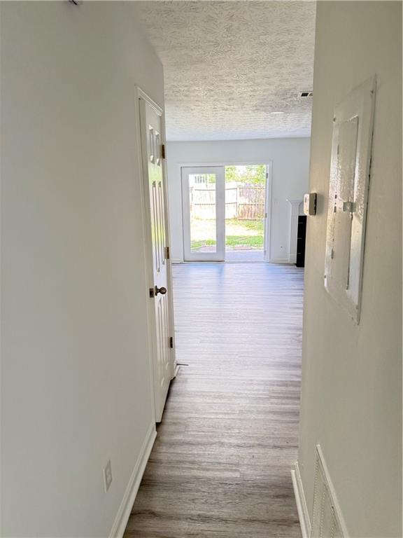 2356 Cove Road Lithonia, GA 30058 - Photo 10 of 20 a view of a hallway with wooden floor and a window