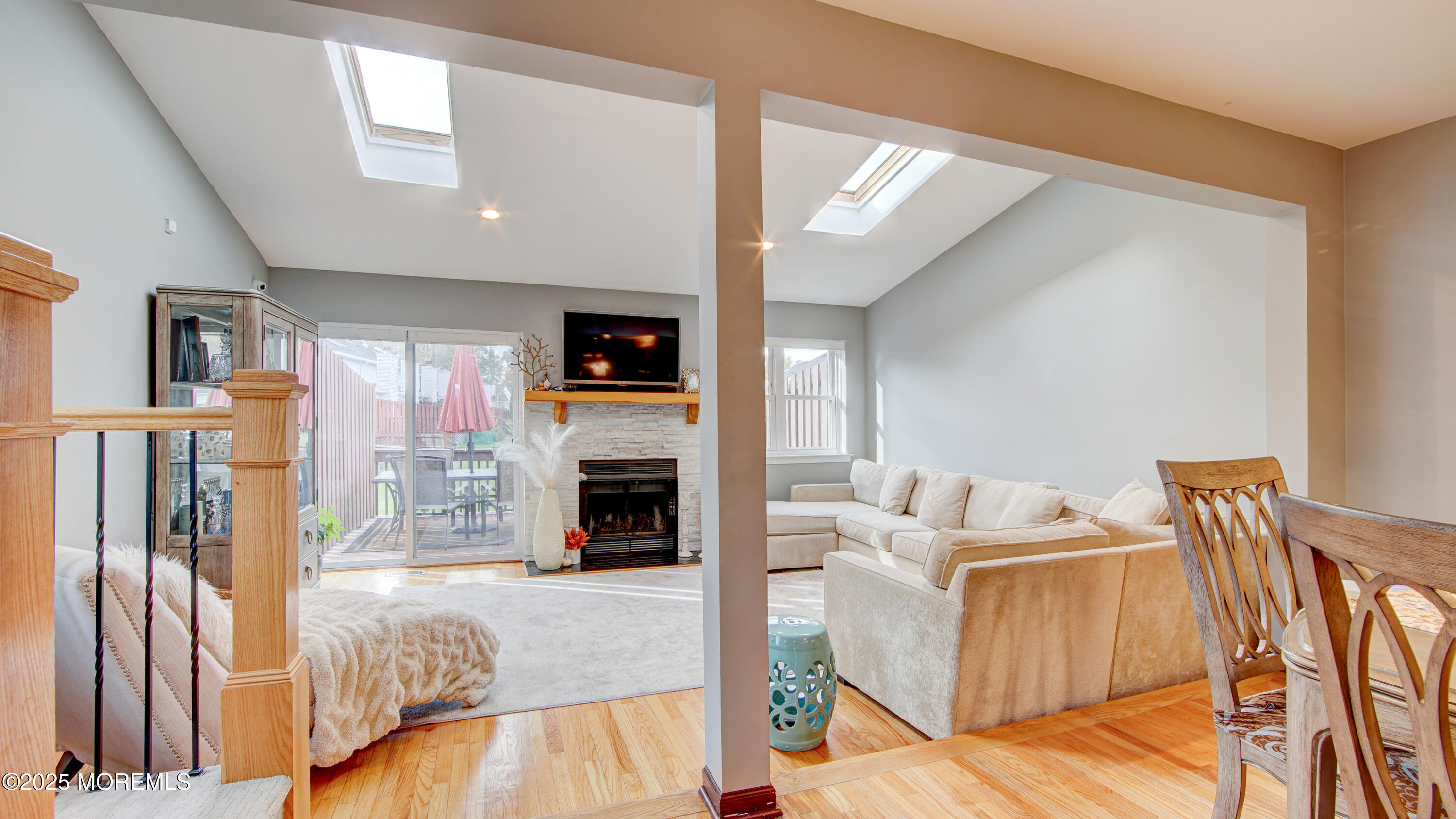 141 Chestnut Way, Unit 141 Manalapan, NJ 07726 - Photo 15 of 46 a living room with furniture and a fireplace