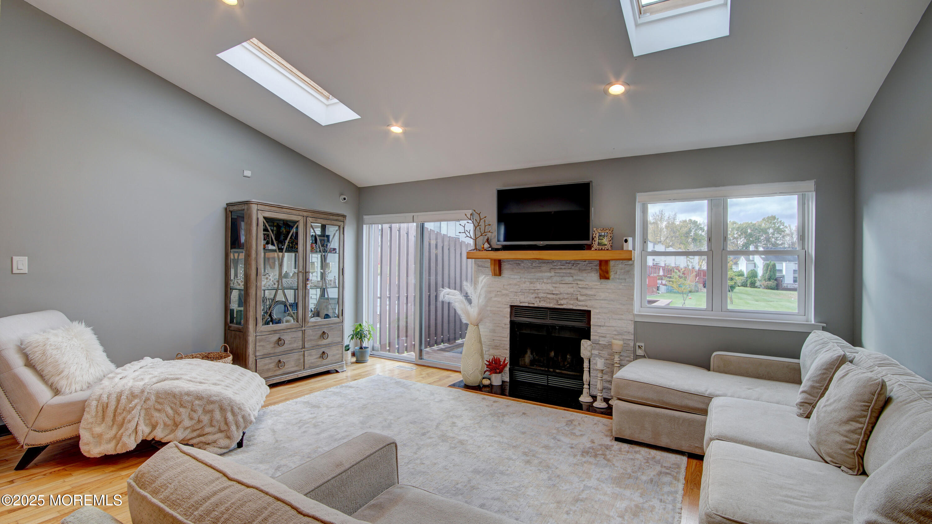 141 Chestnut Way, Unit 141 Manalapan, NJ 07726 - Photo 16 of 46 a living room with furniture and a fireplace